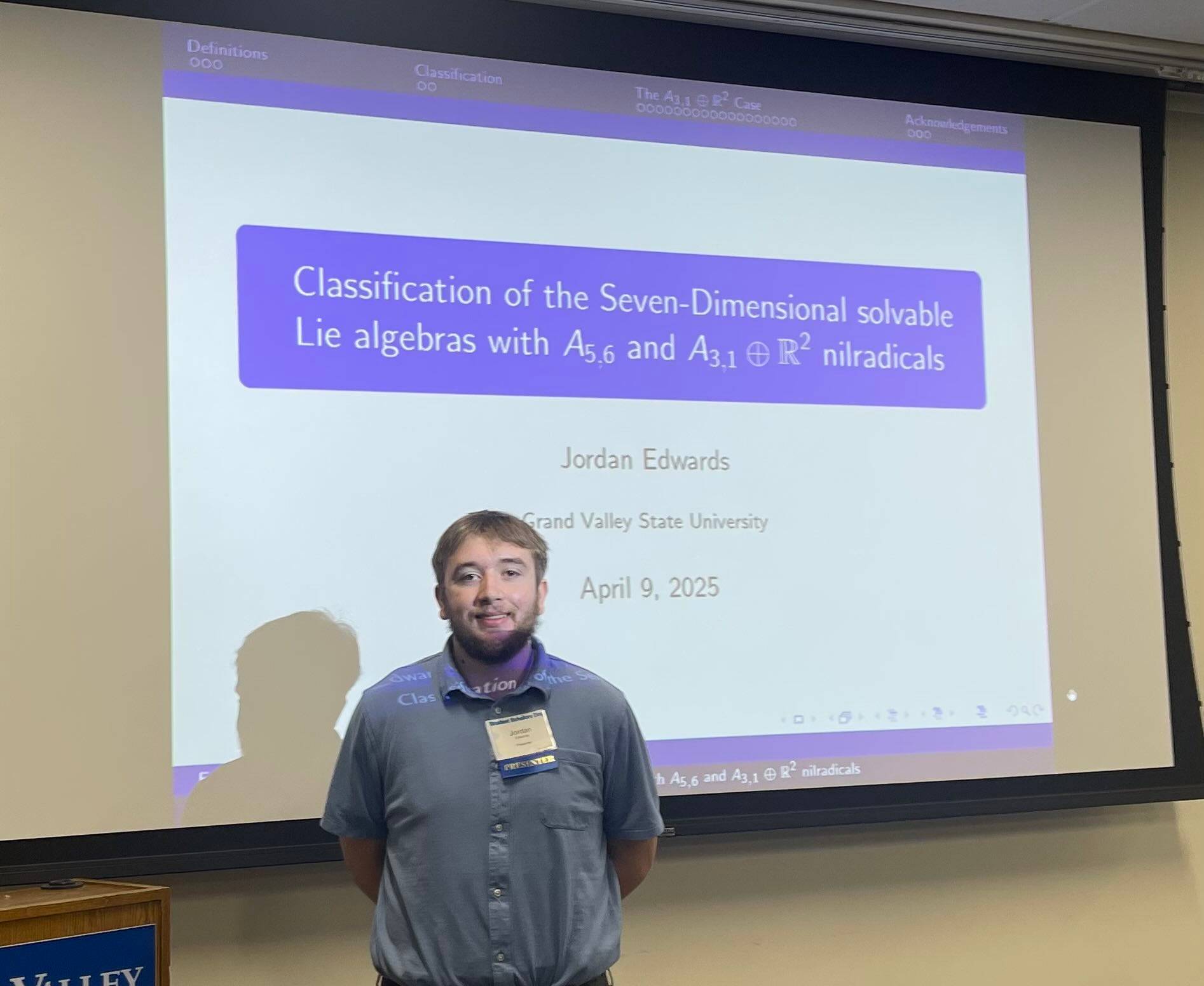 Jordan Edwards in front his presentation slides